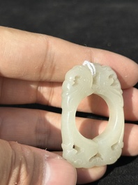 A Chinese white jade cup and two rings, Qing