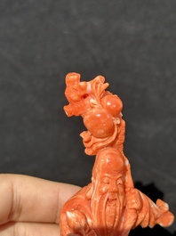 Two Chinese red coral figures of Shoulao on wooden stand, 19/20th C.