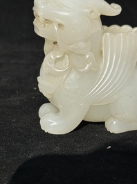 A Chinese white jade carving of a mythic animal, 19/20th C.