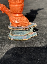 A Chinese carved red coral 'mythical animals' snuff bottle on stand, 19/20th C.