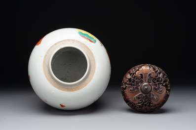 A Chinese famille rose 'Qi Lin Song Zi 麒麟送子' jar and wooden cover, Qianlong/Jiaqing