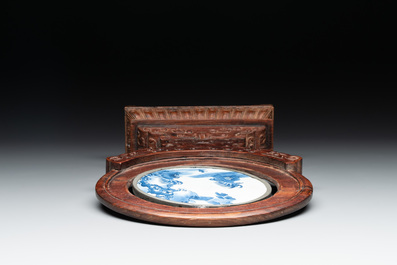 A Chinese blue and white 'Bleu de Hue' 'roosters and chick' plaque in a carved wooden screen and a bowl, 19th C.