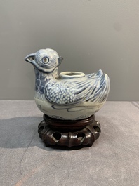 A Chinese blue and white 'double mandarin duck' ewer or water dropper on wooden stand, Ming, ca. 1500