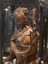 Eight Chinese hardwood figures of female deities, 19th C.