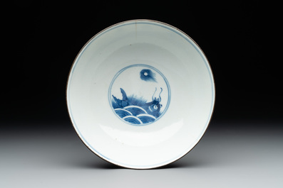 A Chinese blue and white 'Bleu de Hue' 'roosters and chick' plaque in a carved wooden screen and a bowl, 19th C.