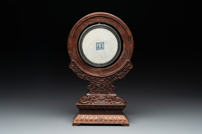 A Chinese blue and white 'Bleu de Hue' 'roosters and chick' plaque in a carved wooden screen and a bowl, 19th C.