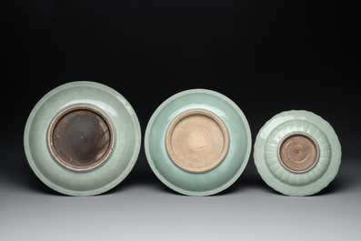 Three Chinese celadon-glazed dishes with floral anhua design, 18/19th C.