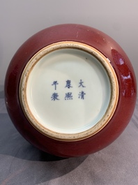 A Chinese apple-green-glazed and two copper-red-glazed bottle vases, Kangxi mark, 19/20th C.