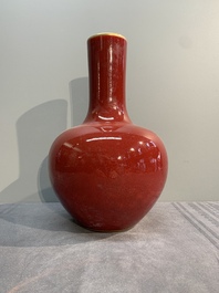 A Chinese apple-green-glazed and two copper-red-glazed bottle vases, Kangxi mark, 19/20th C.