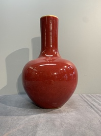 A Chinese apple-green-glazed and two copper-red-glazed bottle vases, Kangxi mark, 19/20th C.