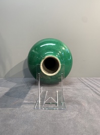 A Chinese apple-green-glazed and two copper-red-glazed bottle vases, Kangxi mark, 19/20th C.