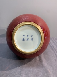 A Chinese apple-green-glazed and two copper-red-glazed bottle vases, Kangxi mark, 19/20th C.