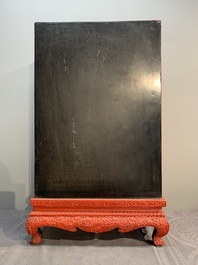 A Chinese cinnabar lacquer 'mountainous landscape' cabinet on a stand, 19th C.