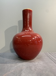 A Chinese apple-green-glazed and two copper-red-glazed bottle vases, Kangxi mark, 19/20th C.