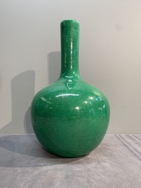 A Chinese apple-green-glazed and two copper-red-glazed bottle vases, Kangxi mark, 19/20th C.