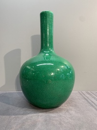 A Chinese apple-green-glazed and two copper-red-glazed bottle vases, Kangxi mark, 19/20th C.