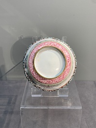 A Chinese Canton enamel 'foreigners' bowl and cover and a 'erotical subject' plate, Yongzheng/Qianlong