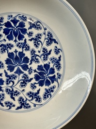 A pair of imperial Chinese blue and white 'lotus scroll' plates, Qianlong mark and of the period