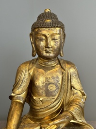 An impressive and large Chinese gilt bronze Buddha, Ming, 16th C.