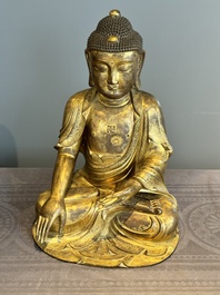 An impressive and large Chinese gilt bronze Buddha, Ming, 16th C.