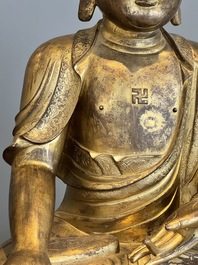 An impressive and large Chinese gilt bronze Buddha, Ming, 16th C.