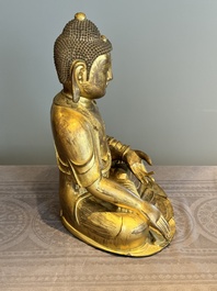 An impressive and large Chinese gilt bronze Buddha, Ming, 16th C.