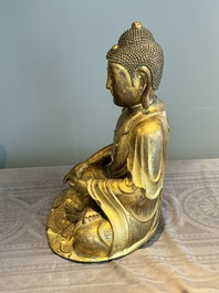An impressive and large Chinese gilt bronze Buddha, Ming, 16th C.