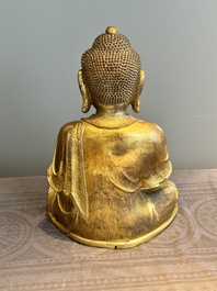 An impressive and large Chinese gilt bronze Buddha, Ming, 16th C.