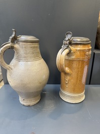 Two stoneware jugs with pewter lids, one with a coat of arms and dated 1636, Germany, 17th C.