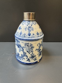 A Dutch Delft blue and white tea caddy with a pipe smoker, 18th C.