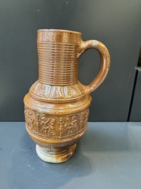 A Raeren stoneware 'peasant dance' jug, late 16th C.