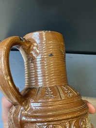 A Raeren stoneware 'peasant dance' jug, late 16th C.