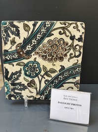 A Syrian Damascus Iznik-style tile with grape and flower scrolls, early 17th C.