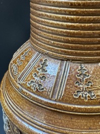 A Raeren stoneware 'peasant dance' jug, late 16th C.