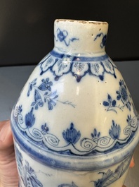 A Dutch Delft blue and white tea caddy with a pipe smoker, 18th C.