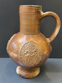 Two armorial stoneware jugs, Raeren, one dated 1586, 16/17th C.