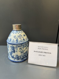 A Dutch Delft blue and white tea caddy with a pipe smoker, 18th C.