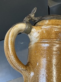 Two stoneware jugs with pewter lids, one with a coat of arms and dated 1636, Germany, 17th C.