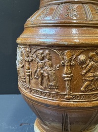 A Raeren stoneware 'peasant dance' jug, late 16th C.