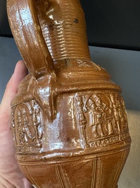 A Raeren stoneware 'peasant dance' jug, late 16th C.