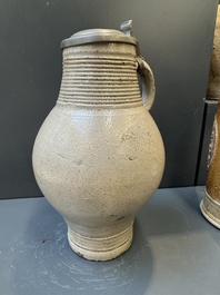 Two stoneware jugs with pewter lids, one with a coat of arms and dated 1636, Germany, 17th C.