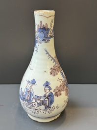 A Dutch Delft blue, white and manganese chinoiserie bottle vase, late 17th C.