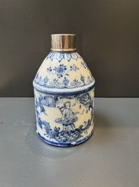 A Dutch Delft blue and white tea caddy with a pipe smoker, 18th C.