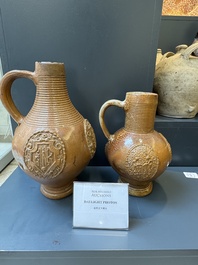 Two armorial stoneware jugs, Raeren, one dated 1586, 16/17th C.
