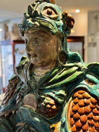 An impressive and fine Chinese sancai-glazed biscuit Guandi, Ming, 17th C.