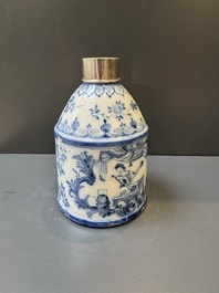 A Dutch Delft blue and white tea caddy with a pipe smoker, 18th C.