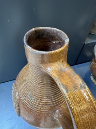 Two armorial stoneware jugs, Raeren, one dated 1586, 16/17th C.