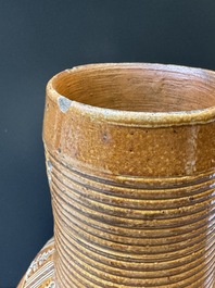 A Raeren stoneware 'peasant dance' jug, late 16th C.