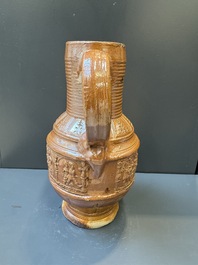 A Raeren stoneware 'peasant dance' jug, late 16th C.