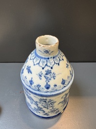 A Dutch Delft blue and white tea caddy with a pipe smoker, 18th C.
